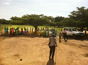 Muzei, age 83, and schoolkids of Teso.