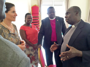 Dr. Dorothy Echodu talking with Bishop Eitu and CMP coordinators the Reverend Sam Eibu and Helen Atilia