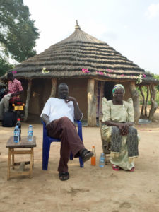 John and Betty Ilukor in front of our house